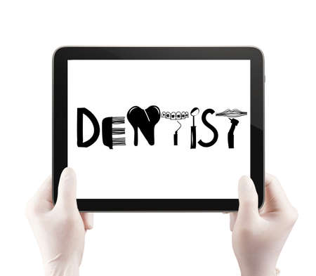 doctor hand hold tablet computer show design word DENTIST as conceptの写真素材