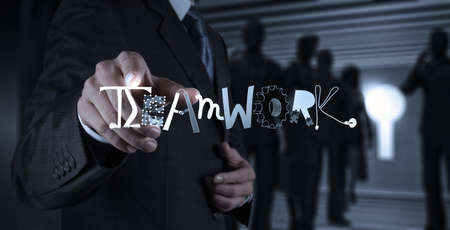 businessman hand drawing design graphic word TEAMWORK as conceptの写真素材