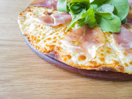 itallian pizza parma ham on wood dishの写真素材