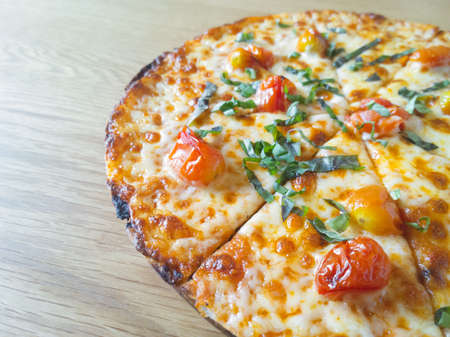 Delicious italian pizza on wood tableの写真素材