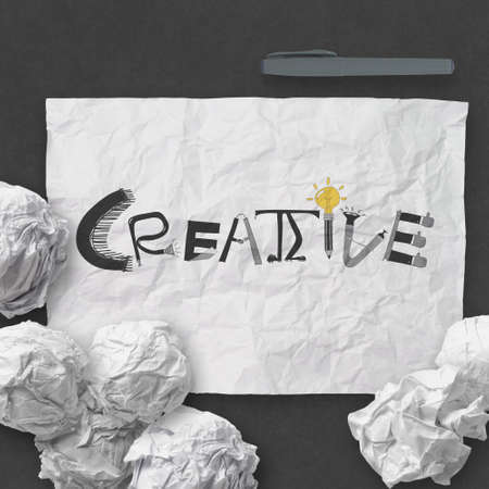 hand drawn  design word CREATIVE on crumpled paper with as conceptの写真素材