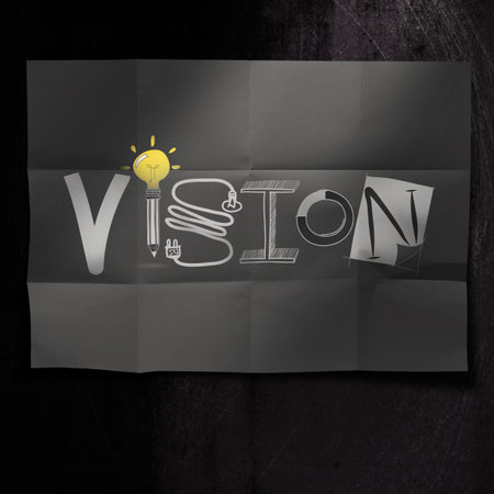  hand drawn VISION design word on crumpled paper background as concept