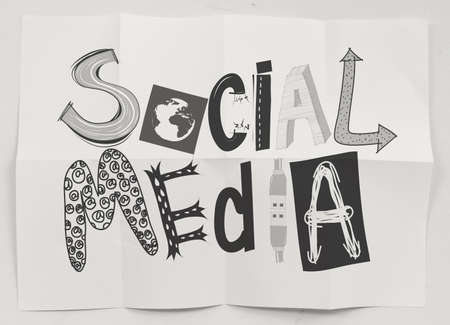 hand drawn social media icons on crumpled paper background as conceptの写真素材