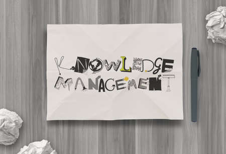 design word KNOWLEDGE MANAGEMENTon crumpled paper as conceptの写真素材