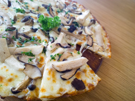 Pizza mushroom and cheese on a wooden board