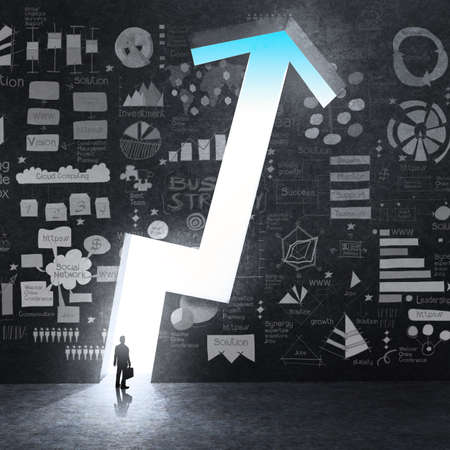 businessman looking at opened concrete wall in form of business graph with hand drawn business strategy as conceptの写真素材