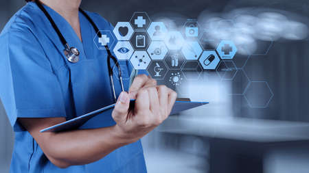 Medicine doctor hand working with modern computer interface as medical concept の写真素材