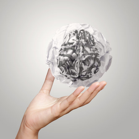 businessman hand showing crumpled paper of 3d metal human brain as security concept