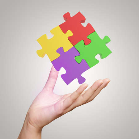 Hand showing 3d puzzle as concept の写真素材