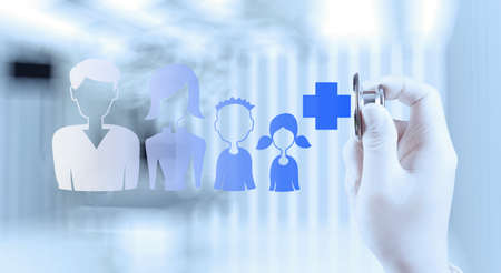 Medicine doctor hand working with modern computer interface as family medical concept の写真素材