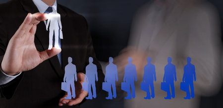 businessman hand choosing people icon as human resources concept 