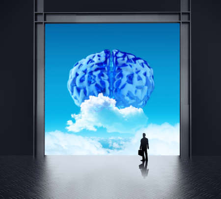 silhouette businessman looking to brain as cloud icon concept の写真素材