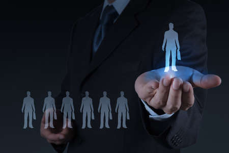 businessman hand choosing people icon as human resources concept の写真素材