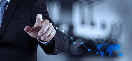 businessman hand working with new modern computer and business strategy as conceptの写真素材