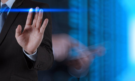businessman hand pressing button with contact on virtual screens as concept