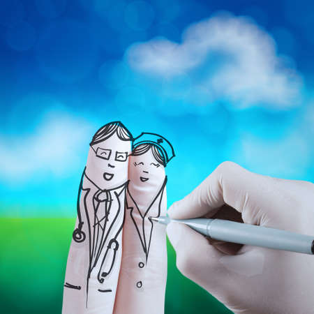 lovely couple hand drawn and finger,doctor and nurse with green nature as concept の写真素材