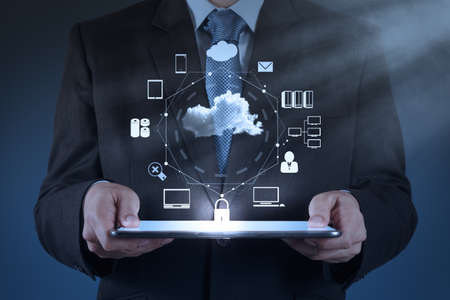 Businessman hand working with a Cloud Computing diagram on the new computer interface as concept Businessman hand working with a Cloud Computing diagram on the new computer interface as concept