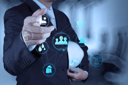 businessman hand working with new computer interface show building development concept