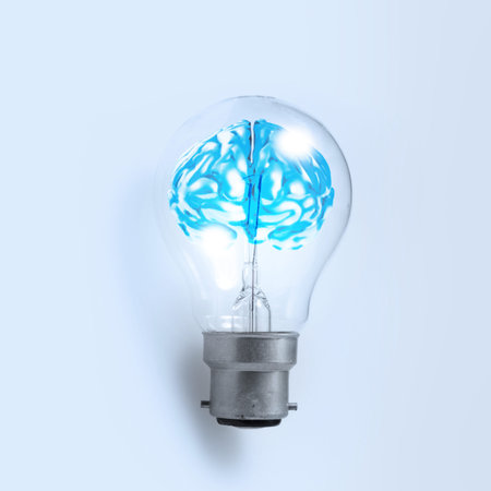 3d metal human brain in a light bulb as creative conceptの写真素材