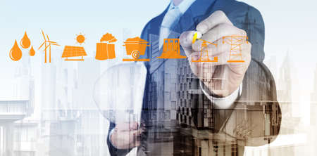 Double exposure of business engineer draw icon of indistry and abstract city as conceptの写真素材