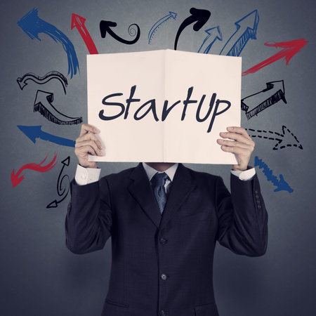 businessman hand show book of startup business as concept の写真素材
