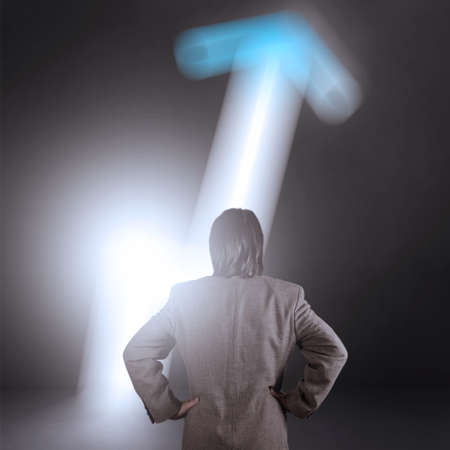 businessman looking at opened concrete wall in form of business graph sign as concept の写真素材