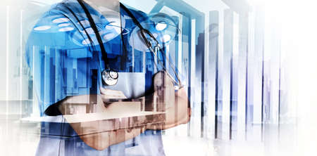 Double exposure of smart medical doctor working with abstract city as concept の写真素材