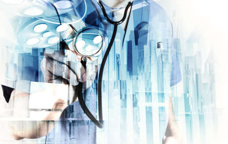 Double exposure of smart medical doctor working with abstract city as concept の写真素材