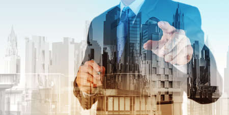 Double exposure of businessman and abstract city の写真素材