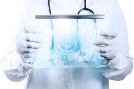 Medicine doctor hand working with modern computer interface as medical conceptの写真素材