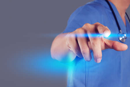 Medicine doctor hand working with modern computer interface as medical concept の写真素材