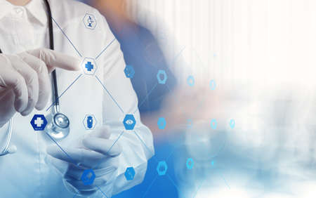 Medicine doctor hand working with modern computer interface as medical concept の写真素材