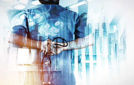 Double exposure of smart medical doctor working with abstract city as concept の写真素材