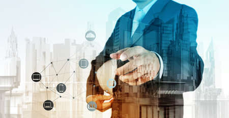Double exposure of business engineer and abstract city as conceptの写真素材