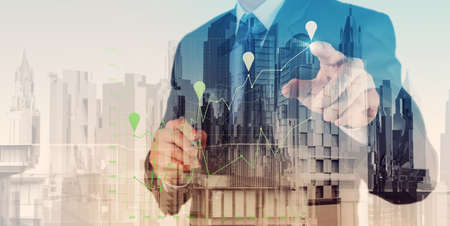 Double exposure of  businessman hand working with new modern computer and business strategy as conceptの写真素材