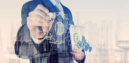 Double exposure of  businessman hand draws gear to success conceptの写真素材