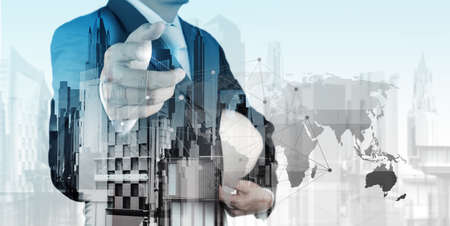 Double exposure of business engineer and abstract city as conceptの写真素材