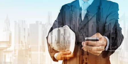 Double exposure of business engineer and abstract city as conceptの写真素材