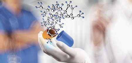 medical doctor with stethoscope in hand with capsule pill and molecule as medical concept の写真素材