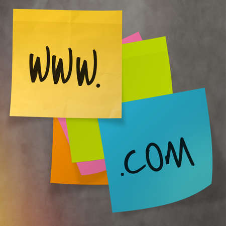 "www dot com" text on sticky note paper on wall textureの写真素材