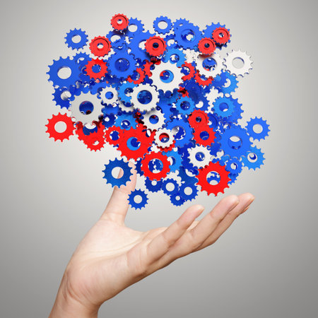 businessman hand showing gears cogs to success conceptの写真素材