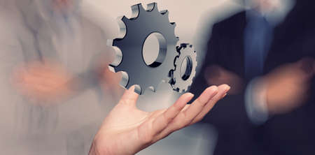 businessman hand draws gear to success conceptの写真素材