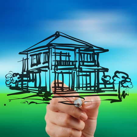 businessman hand draws house and nature backgroundの写真素材