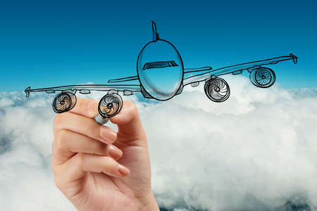 hand drawing airplane on blue sky backgroundの写真素材