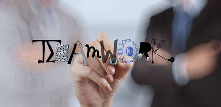 businessman hand drawing design graphic word TEAMWORK as conceptの写真素材