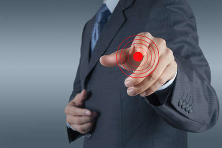 businessman hand shows target symbol as business conceptの写真素材