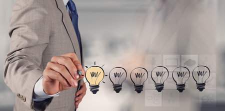 hand drawing creative business strategy with light bulb as concept
