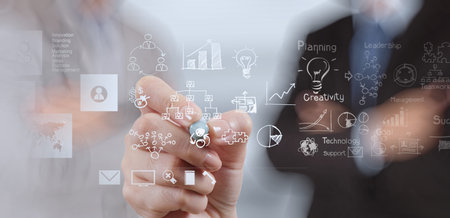 businessman hand working with new modern computer and business strategy as conceptの写真素材