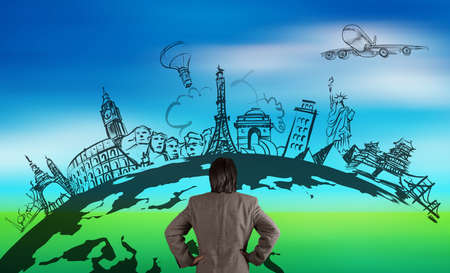 businessman looking at hand drawn traveling around the world by air plane on nature backgroundの写真素材