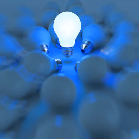3d growing light bulb standing out from the unlit incandescent bulbs as leadership conceptの写真素材